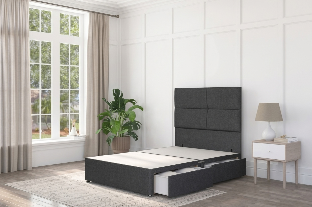 A black divan bed base in a modern interior with a tufted headboard design, with storage drawers opened. 